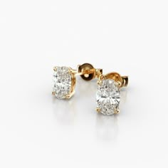 These 14K Yellow Gold Oval Shape Diamond Stud Earrings (1.00 CTW - F-G / VS1-VS2) are a classic and elegant pair of earrings that are sure to make a statement. The oval-shaped diamonds are set in a tapered basket that showcases their beauty. The 14K yellow gold setting gives them a timeless look. It is durable and tarnish-resistant, and will keep your earrings looking their best for years to come. These earrings are perfect for any occasion, from a special event to everyday wear.aka Diamond Stud Earrings Yellow Gold Diamond Stud Earrings, Chunky Diamond Earrings, Oval Diamond Earrings Studs, Big Diamond Stud Earrings, Lab Grown Diamond Earrings, Real Diamond Earrings Unique, Cute Diamond Earrings, Oval Diamond Earrings, Oval Diamond Earring