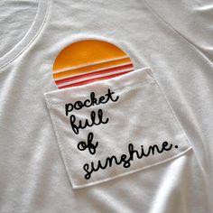 a pocket full of sunshine on a white shirt