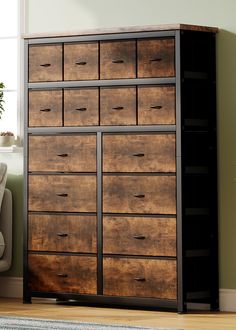 a large wooden dresser sitting next to a window