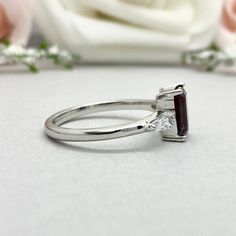 This beautiful ring is made from genuine 925 sterling silver with rhodium plating. Ring details- -The Main stone is an Emerald Cut 8mm by 6mm Lab Created Alexandrite Stone -Side stones are 4mm by 2mm Tapered Baguette simulated diamonds -Ring is casted in solid 925 sterling silver with rhodium plating (rose gold and yellow gold plated also available, please check the drop down menu for more options) -The Total face height of the ring measures 8mms and the band width measures 1.6mms -Each ring is Wedding Emerald Ring In 14k White Gold, Silver Princess Cut Emerald Ring For Wedding, Brilliant Cut Amethyst Ring In Sterling Silver For Promise, Silver Emerald Ring With Princess Cut And Prong Setting, Silver Princess Cut Birthstone Ring With Gemstone, Sterling Silver Amethyst Ring With Brilliant Cut For Promise, 14k White Gold Promise Ring With Emerald Cut, Silver Princess Cut Gemstone Birthstone Ring, Amethyst Ring In Brilliant Cut Sterling Silver For Promise