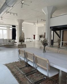 an empty room with tables and chairs in it