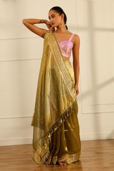 Olive green handwoven tissue silk saree with a floral pattern border. Comes with an unstitched blouse piece. - Aza Fashions Gold Tussar Silk Pre-draped Saree For Reception, Festive Pista Green Chanderi Pre-draped Saree, Festive Pista Green Handloom Pre-draped Saree, Gold Cotton Silk Pre-draped Saree For Reception, Pista Green Tissue Silk Pre-draped Saree With Zari Work, Green Raw Silk Pre-draped Saree With Self Design, Green Tussar Silk Pre-draped Saree With Dupatta, Green Slub Silk Pre-draped Saree For Diwali, Designer Pista Green Pre-draped Cotton Silk Saree