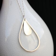 raindrop necklace rainy day minimalist modern jewelry Modern Teardrop Drop Earrings For Everyday, Modern Handmade Teardrop Jewelry, Minimalist Teardrop Sterling Silver Jewelry, Modern Teardrop Pendant Necklace For Everyday, Modern Everyday Teardrop Pendant Necklace, Minimalist Sterling Silver Teardrop Jewelry, Everyday Sterling Silver Teardrop Pendant Necklace, Elegant Teardrop Drop Necklace For Layering, Minimalist Sterling Silver Drop Earrings For Everyday