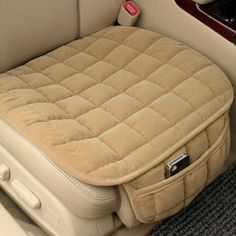 the inside of a car with a dog bed in it's back seat area