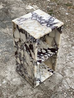 a marbled object sitting on the ground