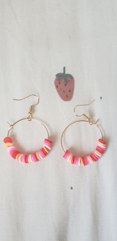 Handmade clay bead earrings. Customizable with 23 different colors to choose from. Trendy Circular Earrings With Colorful Beads, Trendy Pink Round Beaded Earrings, Handmade Heishi Beads Earrings, Handmade Plastic Dangle Earrings, Handmade Plastic Dangle Jewelry, Trendy Colorful Polymer Clay Jewelry, Round Heishi Beads Earrings Gift, Handmade Pink Plastic Earrings, Colorful Heishi Bead Earrings For Gifts