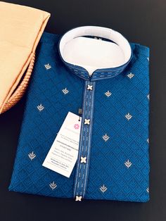 Soft and Premium quality Soft Silk Kurta Pajama in Peacock Blue color Small zari Butti Weaving with self design embroidery material.  Item : Men's Kurta Pajama Ready to Wear : Yes Kurta Color :  Peacock Blue  Pajama Color : Gold Fabric : Soft Silk (Non-Prue)  Pocket : Yes Lining (Yes/No) : No Disclaimer  -For sizing please refer to the Size Chart given in the listing with the pictures.  - Please do NOT go by the size of the Kurta that you already have from another maker. All makers have differen Traditional Indigo Kurta With Pallu, Blue Kurta With Traditional Patterns For Ceremonies, Transitional Blue Kurta For Traditional Ceremonies, Traditional Indigo Sets For Festivals, Traditional Blue Sherwani For Diwali, Ceremonial Blue Kurta With Chikankari Embroidery, Blue Ceremonial Kurta For Festivals, Blue Embroidered Art Silk Kurta, Ceremonial Blue Kurta For Festivals