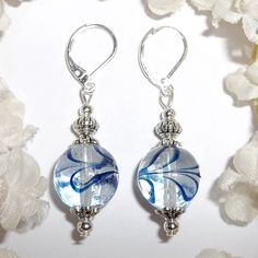 This Gorgeous Beaded Earring Set Was Done With Clear Glass Beads With Navy Blue Swirls. The Pair Have Silver Toned Costume Jewelry Beads That Were Antiqued In Black. They Dangle And Drop From 925 Sterling Silver Lever Backs For Women's Pierced Ears. Measure 1 3/4 Inches Tall & Almost 5/8 Inches Wide. Each Single Earring Weighs 4.3 Grams. A Cute Set To Wear With Denim Jeans! Brand New & Handmade By Me - Wvluckygirl. Great Gift Idea For Her! Buy It Now Before Someone Else Does!!! Dangly Dangling E Sterling Silver Blue Jewelry With Dangling Beads, Silver Dangling Beads Glass Earrings, Blue Silver Beaded Drop Earrings, Blue Silver Beads Drop Earrings, Silver Glass Earrings With Dangling Beads, Silver Earrings With Dangling Glass Beads, Blue Sterling Silver Earrings With Silver Beads, Elegant Blue Jewelry With Silver Beads, Blue Round Glass Earrings