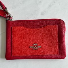 ** Color: Red (Front Pocket Has A Lighter Tone) ** Two Credit Card Slots On The Inside ** Zip-Top Closure ** Silver Details ** Perfect Size For Cards And Cash ** Never Used, Like New Red Rectangular Wallet With Zipper Pouch, Red Pouch With Card Slots For Daily Use, Red Clutch Wallet With Zipper Pouch, Red Zipper Pouch Wallet Clutch, Red Coin Purse With Removable Pouch, Red Coach Wristlet With Zipper Closure, Red Coach Rectangular Wristlet, Coach Red Wristlet With Zipper Closure, Red Coach Wristlet For Daily Use