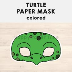 a green turtle mask with black dots on it and the words turtle paper mask colored