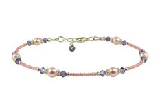 Custom handmade sterling silver tanzanite purple crystal and pink rose pearl beaded anklet. This pink beaded anklet created with pink seed beads, tanzanite purple Swarovski Austrian crystals, pink rose Swarovski crystal-based pearls, Bali .925 silver, and sterling silver. This beaded anklet is custom made to order and available in a variety of sizes. Elegant Adjustable Pink Anklets, Elegant Pink Adjustable Anklets, Pink Anklet, Wedding Anklets, Leather Anklets, Handmade Anklets, Pearl Anklet, Rose Crystal, Beaded Anklet