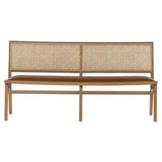 a wooden bench with wicker backrests and seat padding on the side