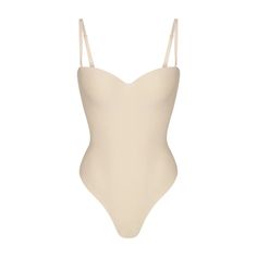 SKIMS BODY UNDERWIRE THONG BODYSUIT | SAND - SKIMS BODY UNDERWIRE THONG BODYSUIT | SAND Cheap Stretch Bodysuit For Club, Luxury Stretch Beachwear Bodysuit, Affordable Club Bodysuit For Women, Luxury Seamless Second-skin Swimwear, Cheap Fitted V-neck Sets, Cheap Spaghetti Strap Bodysuit With Built-in Bra, Cheap White Bodysuit For Beach Season, Luxury Solid Color Bodysuit For Poolside, Luxury Fitted Scoop Neck Bodysuit