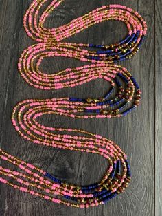 Introducing 'Meryl,' where pink, gold, and purple unite in perfect harmony! 🌸✨ Embrace the elegance and energy of these waist beads that bear her name. Adorn yourself with Meryl and celebrate the beauty of color and style. These beads are exclusively available in a tie-on style, constructed using durable cotton/polyester threads. They measure 45"-50” in length and can be self-adjusted to fit your waist size. ★ The prices listed are for a single strand. If you wish to purchase multiple strands, Gold And Purple, Waist Beads, Spiritual Wellness, Perfect Harmony, Pink Gold, Waist Size, The Beauty, Decorative Accessories, 50 %