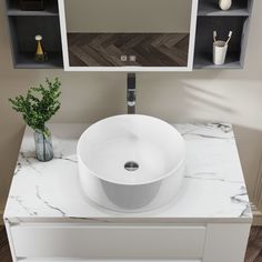 a white sink sitting on top of a marble counter