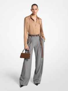 These wide-leg trousers combine timeless tailoring elements, like front pleats and crisp leg creases, with stretch-infused virgin wool sourced from an Italian mill. A high-rise fit evokes a strong feminine aesthetic. Balance its soft hand and languid drape with pointed-toe heels. Made in Italy. Tailored Wide Leg Pants For Business In Fall, Luxury Wide Leg Pants For Fall, Fall Business Wide Leg Pants With Pressed Crease, Classic Wide Leg Pants For Evening In Fall, Structured Pants For Fall Workwear, Structured Office Pants For Fall, Structured Fall Office Pants, Elegant Business Wide Leg Pants For Fall, Designer Tailored Pants For Workwear