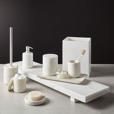 white bathroom accessories including soap and toothbrush