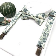 "Floral Sage Green Suspenders, Floral Sag Bow tie, Suspender Bowtie, Wedding Floral Suspenders, Groomsmen Suspenders, Ring bearer outfit Welcome to Justformanboutique! It is a wonderful set that I have prepared completely handmade from first quality fabric and you will not find it in any other store. Please message me if you would like more information about this suspenders and bow tie set that will make you feel unique on your most special days.  If you want to buy the tie of the same product, Fitted Suspenders For Groom Suit And Tie Accessories, Groom's Bow Tie With Suspenders, Dapper Suspenders For Wedding, Dapper Wedding Suspenders, Summer Bow Tie For Groom, Sage Green Suspenders, Floral Suspenders, Suspenders Ring Bearer, Suspenders Groomsmen