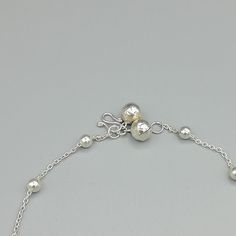 Sterling silver anklet with silver balls and tear drop charms. Comes with two 6mm bell. Length: 10 inches. Tear drop: 4 x 12 mm Ball: 3mm Price listed is for ONE piece. These anklets are made of 925 hypoallergenic sterling silver. All my pieces are sent in a gift box. I can include a personal message from you if needed. You are welcome to contact me at... bhavnakwintra1956@gmail.com More anklets https://www.etsy.com/shop/TheSilverGame?ref=seller-platform-mcnav&section_id=26713873 More hoops: Silver Anklets With Adjustable Chain For Parties, Festive Silver Adjustable Anklets, Elegant Sterling Silver Anklets With Adjustable Chain, Silver Adjustable Dangle Anklets, Silver Adjustable Chain Metal Anklet, Sterling Silver Anklet, Ear Climbers, Silver Anklets, Foot Jewelry