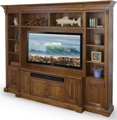 an entertainment center with a large television on it's side and shelves in the middle