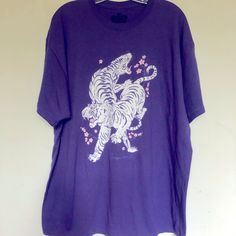 Oversized Tiger T Shirt Size Xl Made From A Soft Washed Down Cotton With Short Sleeves 100% Cotton New Perfect For Men Or Women Chest 24.5” Length 31” Oversized Tiger T Shirt Casual Purple Shirt With Graphic Print, Relaxed Fit Purple Shirt With Graphic Print, Oversized Short Sleeve Screen Print Shirt, Oversized Short Sleeve Shirt With Screen Print, Purple Graphic Tee With Relaxed Fit, Purple Relaxed Fit Graphic Tee, Purple Cotton Graphic Tee Shirt, Oversized Purple Screen Print Top, Casual Purple Screen Print Shirt