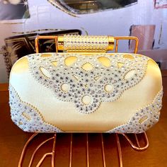 Gorgeous Golden & Rhinestones Clutch. It Can Be Worn At The Shoulder With The Chain Type Strap Or As A Clutch. Very Easy To Match To Your Already Beautiful Outfit. Brand New Never Used Before Tags Attached. Elegant Embellished Clutch For Banquet, Glamorous Gold Clutch For Banquet, Elegant Yellow Bags For Formal Occasions, Elegant Yellow Bag For Formal Occasions, Elegant Yellow Formal Bag, Elegant Yellow Formal Bags, Chic Crystal Evening Bag For Weddings, Yellow Elegant Clutch For Formal Occasions, Elegant Yellow Clutch For Formal Occasions