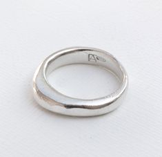 I want great design to be accessible to everyone.  This ring was hand carved in wax, casted into silver, and hammered by me in Phoenix, AZ. Because of this process, every ring is slightly different. This is a organic shaped sterling silver ring that has a hammer texture. Each ring is different, just like its owner. The general dimension of this ring are a width of ~4-5mm, with the highness part of the ring measuring ~4mm and the thinnest being 1.5mm. I offer a lifetime craftsmanship warranty on all of my pieces. Available in gold or other metals, just send me a message. Check out my other work at https://www.etsy.com/shop/EvelynArmine?ref=seller-platform-mcnav Follow me @evelynarminedesigns on instagram for more photos and updates on what is happening in my shop! Wax Carved Ring, Accessory Inspo, Edgy Jewelry, Wax Carving, Carved Ring, Hammered Band, Hammered Silver, Phoenix Az, Organic Shapes