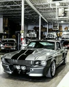 an old car is parked in a garage