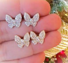 14k Gold diamond and gold with white finish butterfly earring. ( Price for one pair ) Gold Wt :- 2.40Gram Diamond Wt :- 1.60Ct.   14k Gold diamond and gold with white finish butterfly earring. Beautiful handmade 14k Gold diamond and gold with white finish butterfly earring. Light weight . perfect for gifting and wedding. We keep on adding new products & designs every day so keep coming back to get more deals & designs. Bulk & wholesale orders are welcome on this designs. kindly contact more than 5 pcs. of a kind. Butterfly-shaped Cubic Zirconia Earrings For Formal Occasions, White Gold Butterfly Charm Earrings, Butterfly-shaped Diamond White Jewelry For Wedding, Butterfly Cubic Zirconia Earrings For Formal Occasions, Butterfly Cubic Zirconia Earrings For Formal Events, Diamond White Butterfly Jewelry For Wedding, White Gold Butterfly Earrings With Charm, White Gold Butterfly Earrings Fine Jewelry, White Gold Butterfly Fine Jewelry Earrings