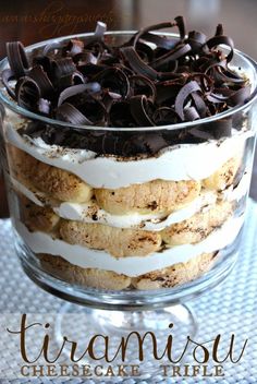 there is a layered cake with chocolate chips in the middle and whipped cream on top