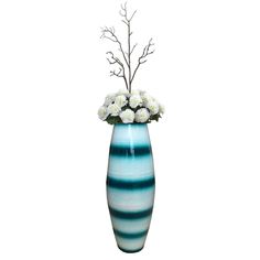 a blue and white striped vase with flowers in it on a white background for display