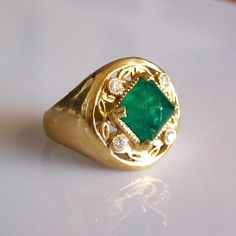 Exquisite Sugar Loaf Emerald & Diamond Ring.  This ring is part of our special one of Temple jewel Creations.   * 18k Solid Gold * Natural Ethically sourced Sugar loaf Columbian Emerald * Diamonds : 4 x 0.03kt Vs Si Brilliant natural Ethically sourced   * Free Worldwide Ensured DHL express shipping to most countries * Sizing included from 5us to 8us Custom orders Welcomed! Emerald Rings With Single Cut Diamonds For Anniversary, Luxury Yellow Gold Emerald Ring With Single Cut Diamonds, Emerald Rings With Single Cut Diamonds For Gifts, Luxury Emerald Ring With Single Cut Diamonds For Anniversary, Elegant Gia Certified Diamond Signet Ring, Luxury Green Rings With Single Cut Diamonds, Unique Emerald Ring With Diamond For Formal Occasions, Unique Formal Emerald Ring With Diamonds, Formal Heirloom Emerald Ring With Single Cut Diamonds