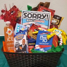 a basket filled with lots of different types of snacks and drinks on top of a table