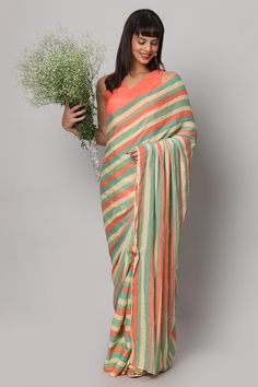 This striped pastel yellow, green, and coral saree is a festive stunner! The sequin work on this saree gives the perfect amount of shine and glam to it - Pair this saree with a sexy coral blouse and some chunky earrings. Suitable for Glam parties, Beach parties, Wedding reception & cocktail events. About this Product Saree: Saree Type: Ready to wear, Pre-stitched, Pre-draped Saree Saree Color: Multi-colored Saree Fabric: Georgette with Sequins Type of Work: Striped with Sequins Trim: Tassel-work Green Saree For Summer Party, Green Summer Party Saree, Summer Party Green Saree, Multicolor Pre-draped Saree For Diwali, Summer Green Pre-draped Saree, Multicolor Zari Work Blouse Piece For Summer, Green Pre-draped Saree With Unstitched Blouse For Summer, Summer Green Pre-draped Saree With Unstitched Blouse, Summer Multicolor Blouse Piece With Zari Work