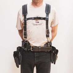 Equip yourself with the toughest tool belt on the market - featuring all 3 of our signature Tool Bags, Harness and finally our Belt with Belt Pad. Solid brass, bonded nylon stitching and steel hardware along with pull-up, South American leather means you can tackle any job with ease. Lightweight compared to other tool bags on the market, without sacrificing function.  Each full set includes the following: Full Harness and Shoulder Pads Belt and Belt Pad Bag 1 Bag 2 Bag 3 Measures: Harness is one Black Harness With Belt Loops For Everyday Use, Carpenters Belt, Tool Belt Pouch, Rafter Square, Leather Tool Belt, Tool Belts, Work Belt, Pouch Handmade, Tool Bags