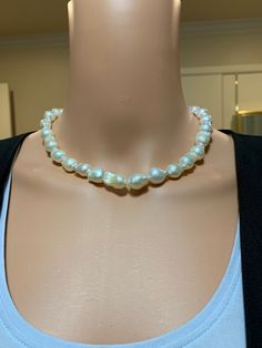 "White Flameball Baroque Pearl Necklace. This hand knotted strand features 30 White Freshwater Baroque \"Flameball\" Pearls bead nucleated AAA High Luster rose overtones Genuine and Natural 9.9X13.2 to 11.1X15.4mm. These amazing pearls are perfectly matched with very thick nacre, very few blemishes. I hand knotted this strand with white silk thread and finished it with a 925 silver magnetic clasp, the necklace measures 17 1/4 inches in length. The necklace pictured is the one you will receive. P Round Pearl Necklace With Polished Beads, Elegant Rondelle Beaded Necklaces With Large Beads, Elegant Hand-strung Beaded Necklaces, Elegant Large Bead Pearl White Necklace, Elegant Pearl White Necklace With Large Beads, High Luster Round Beads Necklace, Elegant Large Beaded Pearl White Necklace, White Hand Knotted Jewelry With Round Beads, Hand Knotted White Round Bead Jewelry