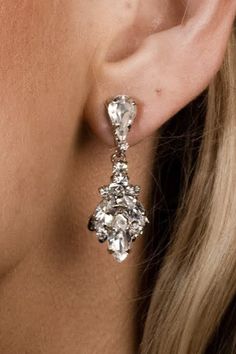 Introducing our IDIL Swarovski Drop Earrings! Inspired by tear drop shaped crystal that trickles down the ear to add a lasting touch to every look. These will look elegant with a casual look or a night out paired with your favorite dress and heels. They are meant to become your earrings of choice for high-style event. Love this earring but looking for something daintier? Check out our NAZ Earrings! Handcrafted Highest Quality Swarovski / Cubic Zirconia Platinum plated Guards against scratches an Earring Inspired, Swarovski Drop Earrings, Crystals Earrings, Boutique Couture, Swarovski Crystal Earrings, Earrings Wedding, Drop Earring, Silver Drop Earrings, Wedding Jewelry Sets