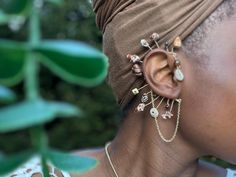 THESE HOOKS ARE MADE TO ORDER AND THUS MAY NOT HAVE THE EXACT SHELLS IN THE EXACT POSITIONS AS SHOWN IN THE LISTING PHOTOS. these handmade no-piercing earrings hook safely on the back of the ear. since the hooks themselves are malleable, you can shape them to your ear so they don't fall off! materials: thrifted cowrie shells anti tarnish craft wire (gold plated, copper fill) anti tarnish chain (gold plated, copper fill) ~*because i make these hooks to be adjusted and customized to the owner's ear, my policy is to not accept returns and exchanges. however, if there is an issue with your product, please let me know Faux Piercing, Ear Crawler, Ear Crawlers, Piercing Earrings, Wrap Earrings, Cowrie Shells, Fake Piercing, Ear Cuffs, Cowrie Shell