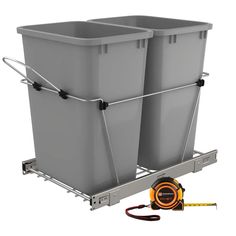 two gray trash cans sitting next to each other on top of a metal rack and measuring tape