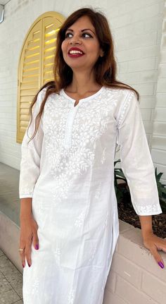 Introducing our White Women's Chikankari Kurta Long, a stunning fusion of style and comfort designed for warm weather elegance. This airy and lightweight Indian cotton white kaftan dress is your perfect companion on scorching summer days. What's more, the softness of this cotton kurta only deepens with each wash, ensuring a delightful wearing experience. This hand-embroidered beauty isn't just a piece of clothing; it's an ideal choice for functions and parties. Whether you're aiming for a classi Elegant Straight Kurta Tunic For Summer, Elegant Summer Straight Kurta Tunic, Casual White Long Sleeve Kaftan, Festive White Beach Dress, White Tunic With Chikankari Embroidery, White Casual Kurta With Floral Embroidery, White Long Sleeve Chikankari Tunic, White Long Sleeve Tunic With Chikankari Embroidery, White Long Sleeve Kaftan For Daywear