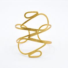 Triton Cuff - By Aris Elegant Gold Spiral Cuff Bracelet, Elegant Gold Spiral Bangle, Modern Twist Flexible Bangle As Gift, Elegant Bangle Bracelets With Unique Design, Adjustable Contemporary Bangle Bracelet, Adjustable Gold Fusion Style Cuff Bracelet, Adjustable Gold Fusion Cuff Bracelet, Adjustable Gold Cuff Bracelet In Fusion Style, Modern Twist Cuff Bracelet Bangle For Formal Occasions