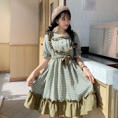 Plaid Green Loose Mori Girl Short Sleeve Dolly Dress with Peter Pan Collar One Size Length 89cm/35" Shoulder Width 39cm/15.5" Bust 94cm/37" Waist 70 ~ 100cm (stretchy elastic)/27.5"-39.5" Material: Polyester Spring Patchwork Dress With Doll Collar, Spring Patchwork Doll Collar Dress, Cute Green Dress With Doll Collar, Cottagecore Short Sleeve Dress With Ruffle Hem, Casual Vintage Short Sleeve Dress With Ruffles, Casual Vintage Dress With Ruffles And Short Sleeves, Cute Green Daywear Dress, Cute Green Knee-length Dress, Green Cottagecore Dress With Ruffles