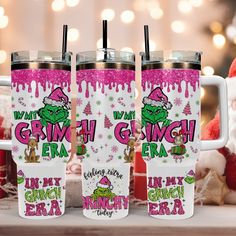 three christmas themed tumblers sitting on top of a table