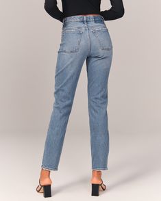 On-trend high rise mom jeans in our all-day comfort stretch denim, with a medium wash and distressed hem. Spring Mom Fit Cropped Jeans With Frayed Hem, Spring Cropped Mom Jeans With Frayed Hem, High Rise Mom Fit Cropped Jeans In Rigid Denim, High Rise Mom Fit Bottoms With Frayed Hem, Fitted Cutoff Everyday Jeans, Mom Fit Denim Blue Bottoms With Frayed Hem, Mom Fit Denim Cropped Jeans With Frayed Hem, Mom Fit Jeans With Frayed Hem And Straight Leg, Mom Fit Dark Wash Cropped Jeans With Frayed Hem