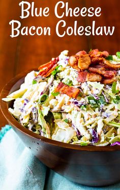 a wooden bowl filled with coleslaw and bacon