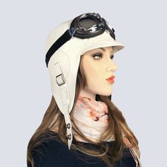 "Women's white leather aviator hat/cap, pilot-style helmet, timeless style, with goggles if desired, unisex hat. Ideal for an aviator look, convertible car riding or bicycle rides, daily use, an aviator steampunk costume, party, bachelorette party, etc. Made of soft white leather and black nylon lining, which is comfortable for spring, summer and fall. ADJUSTABLE STRAPS on each side allow the hat to be attached under the chin and upwards, with snaps fasteners. A buckle at the back of the hat all Adjustable Windproof Aviator Hat, White Adjustable Leather Hat, Adjustable White Leather Hat, White Visor Hat For Travel, White Travel Visor Hat, Aviator Helmet, Aviator Costume, Black Goggles, Aviator Cap