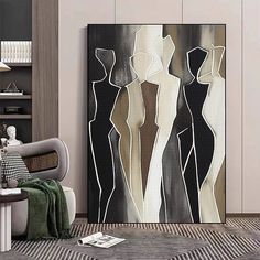 a living room with an abstract painting on the wall