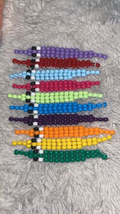 several rows of beaded bracelets laid out on the floor