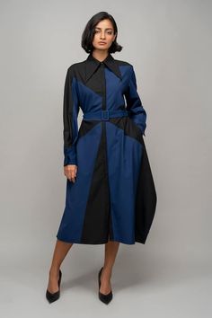 Navy blue and black full sleeves shirt dress with a composition color block pattern and front placket highlighting the asymmetrical side hem of the garment. Comes with a matching buckle belt. - Aza Fashions Designer Long Sleeve Dresses For Workwear, Long Sleeve Patchwork Dresses For Office, Long Sleeve Patchwork Office Dress, Modern Long Sleeve Shirt Dress For Work, Long Sleeve Blue Shirt Dress For Work, Blue Long Sleeve Shirt Dress For Work, Office Blue Midi Length Shirt Dress, Formal Blue Long Sleeve Shirt Dress, Black Shirt Dress With Belted Cuffs For Workwear