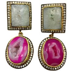 Double Drop druzy earrings features slice geode in pink and white. Embellished with cubic zircon with clutch back closure. Only 1 available. 18K Gold Plated. FOLLOW MEGHNA JEWELS storefront to view the latest collection & exclusive pieces. Meghna Jewels is proudly rated as a Top Seller on 1stDibs with 5 star customer reviews. All items manufactured by us are handmade and can be customized or redesigned.